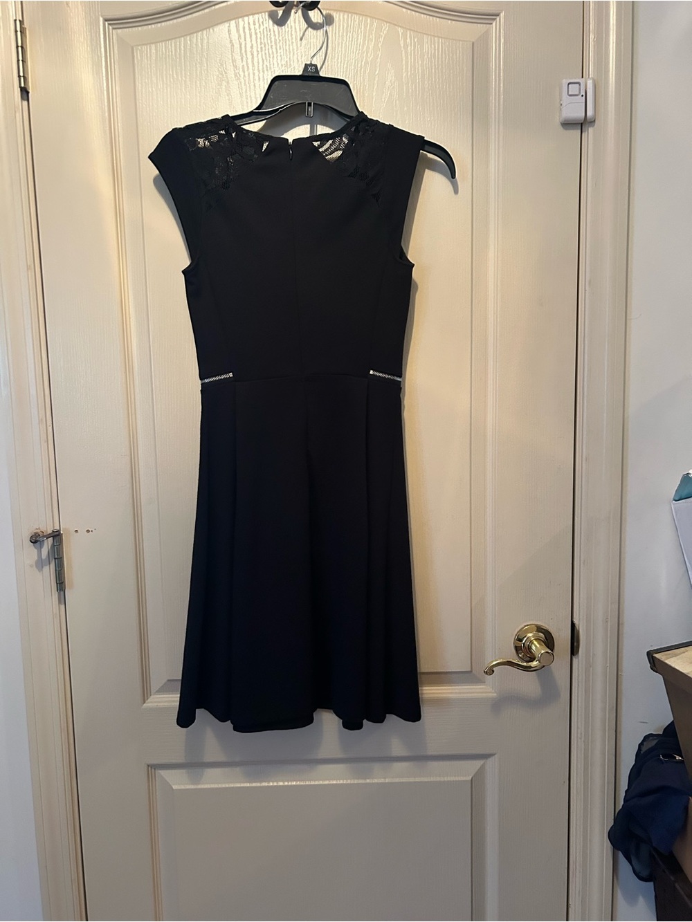 Classic Black Sleeveless A-Line Dress with Embellished Neckline - Picture 2 of 4